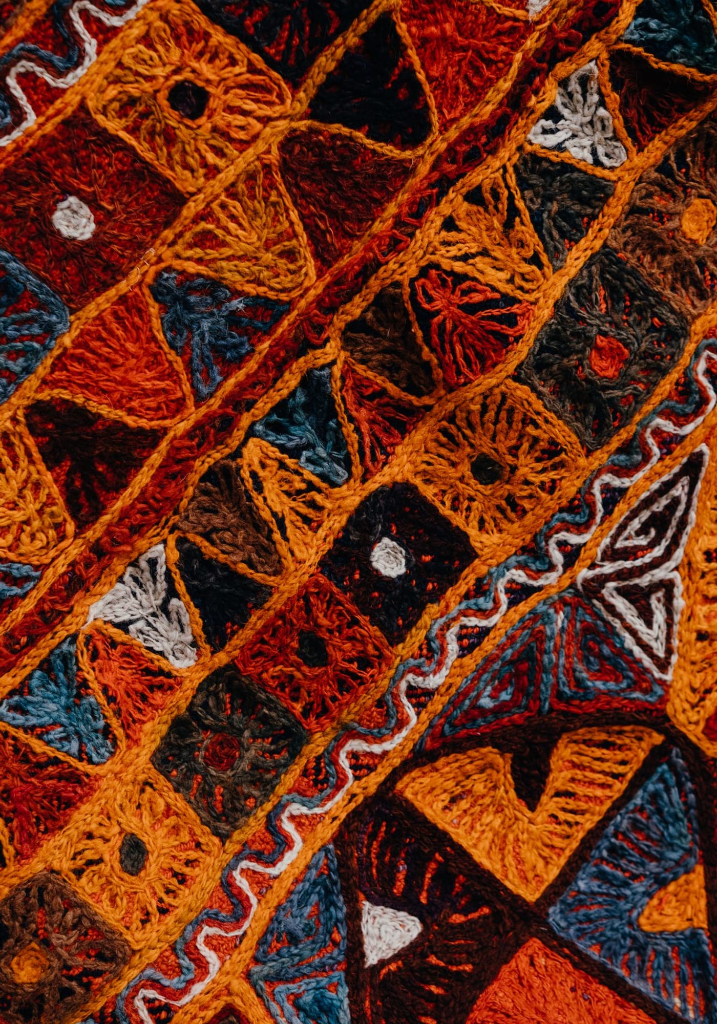 Punjabi-style home interior styled by Her Homes Co. — phulkari, brass, handloom, generous.